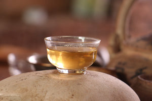 tea cup on top of a rock